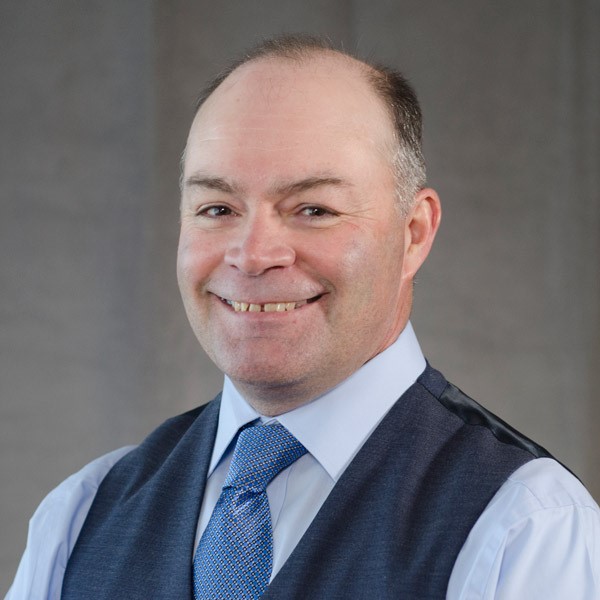 A headshot of Bret W. Hess