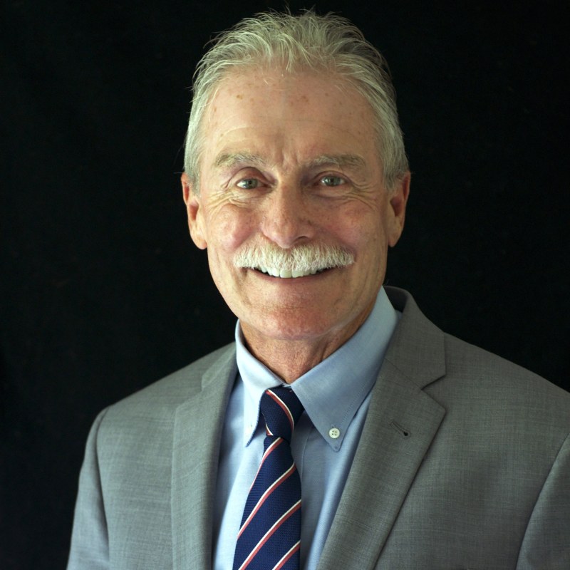 A headshot of Richard C. Rhodes III